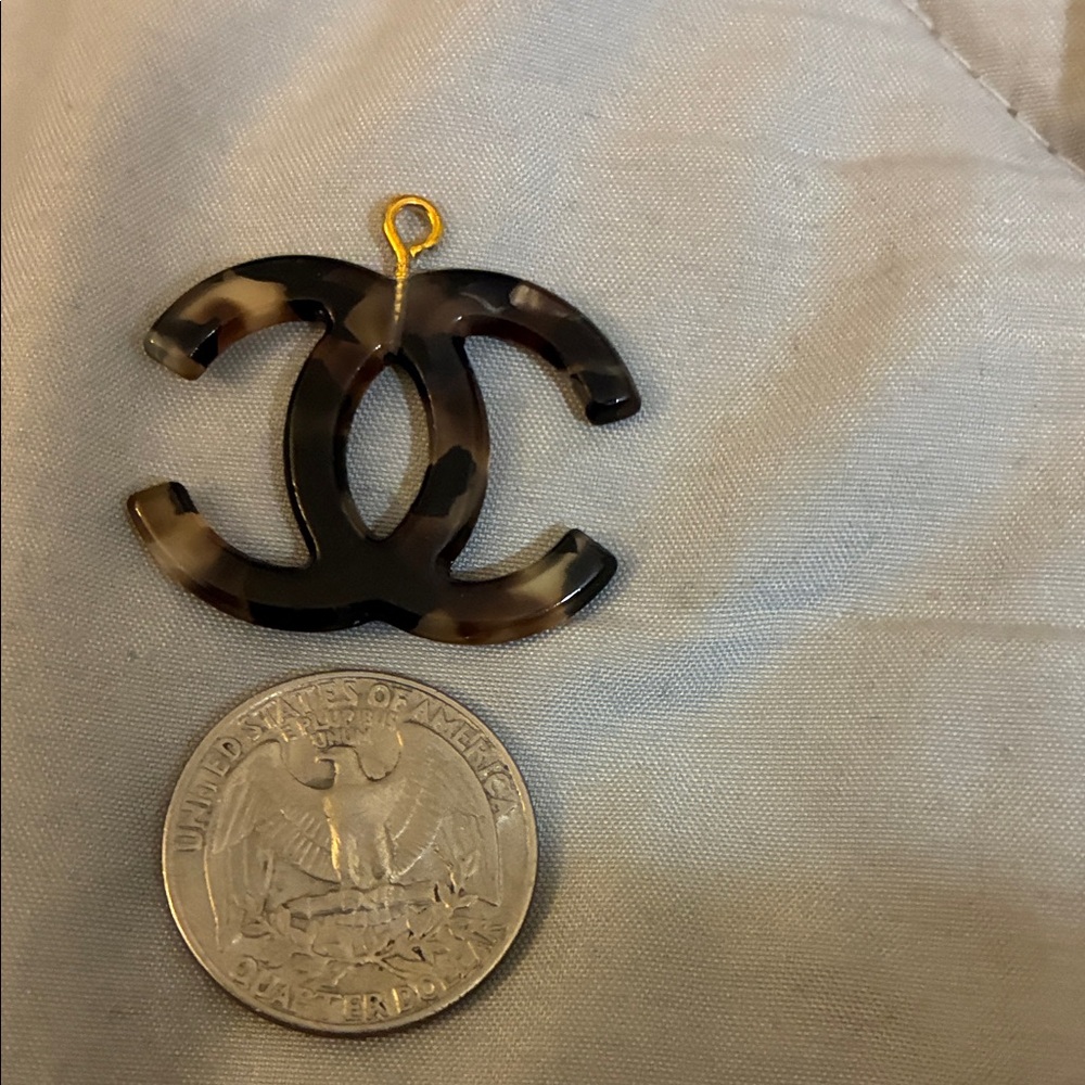 CHANEL Stamped Brown and Black Charm